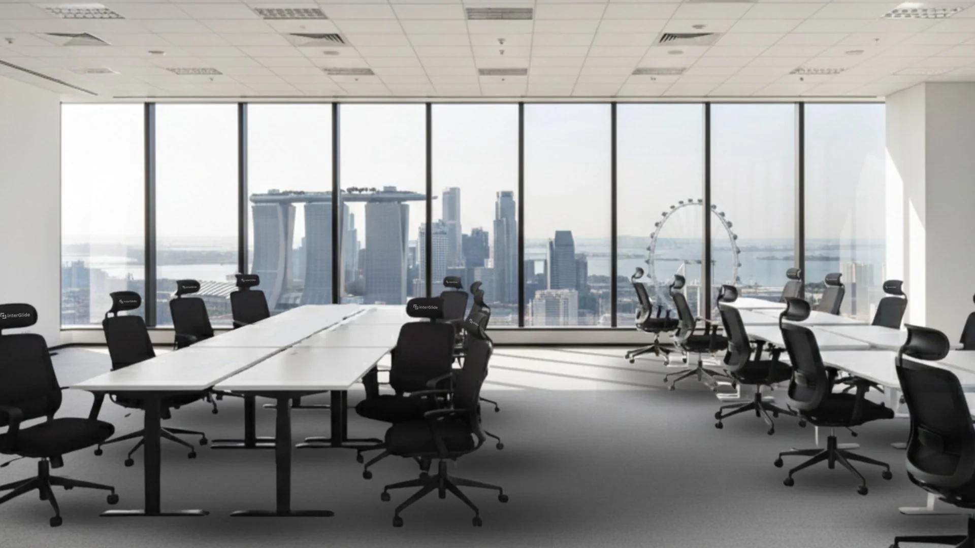 Interdesk desks and InterGlide chairs deployed in a corporate workspace overlooking the Singapore skyline